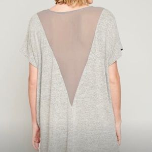 Oversized tee. small but could fit medium or large